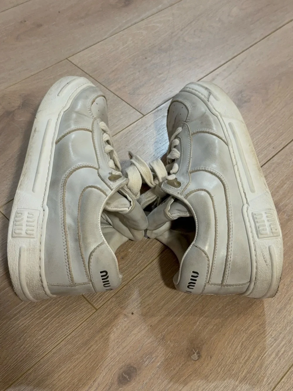 Miu Miu Off-White Leather Sneakers with Gold Trim
